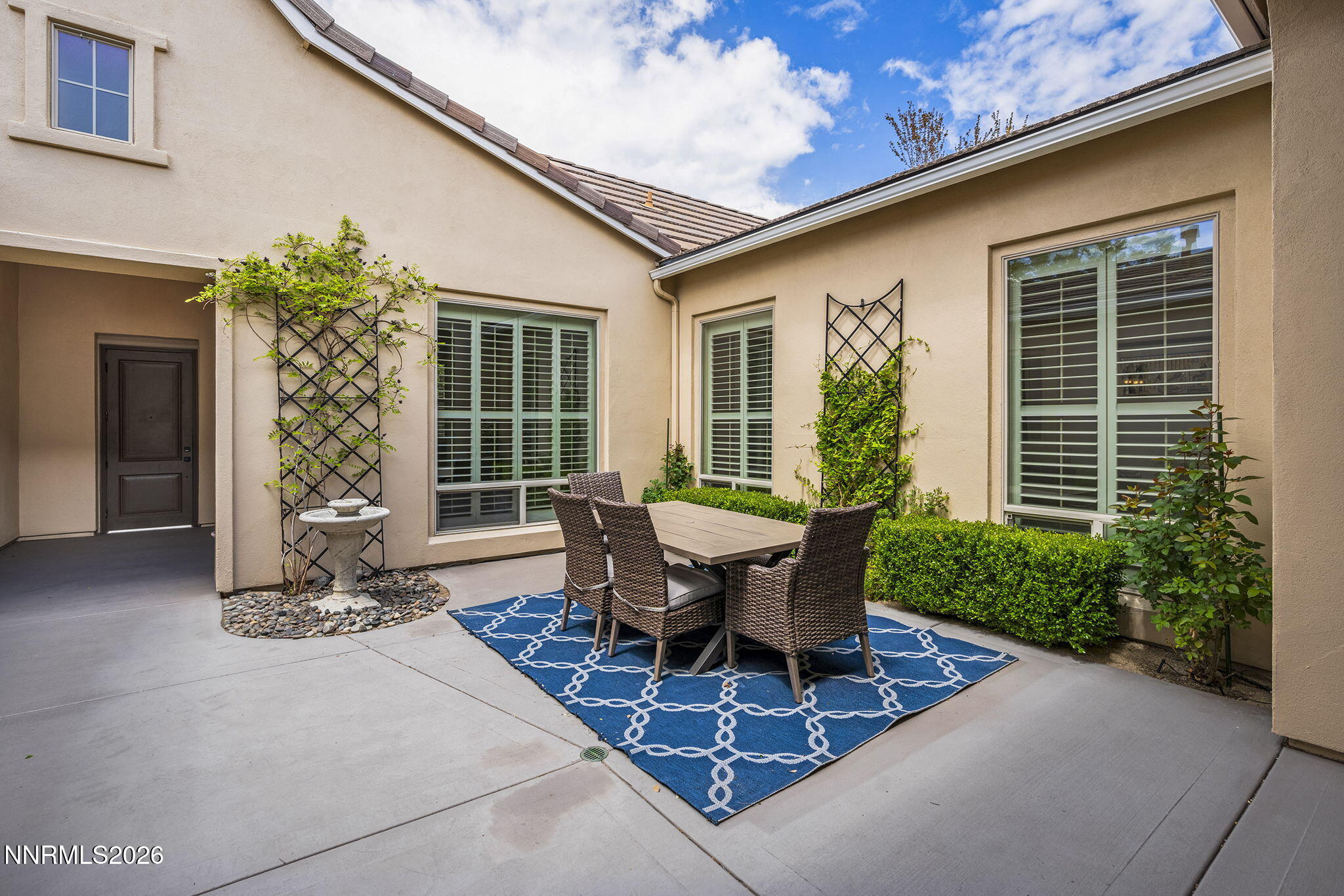 13340 Damonte View Lane Reno, NV 89511 - Photo 4 of 44 a view of a house with backyard sitting area and garden