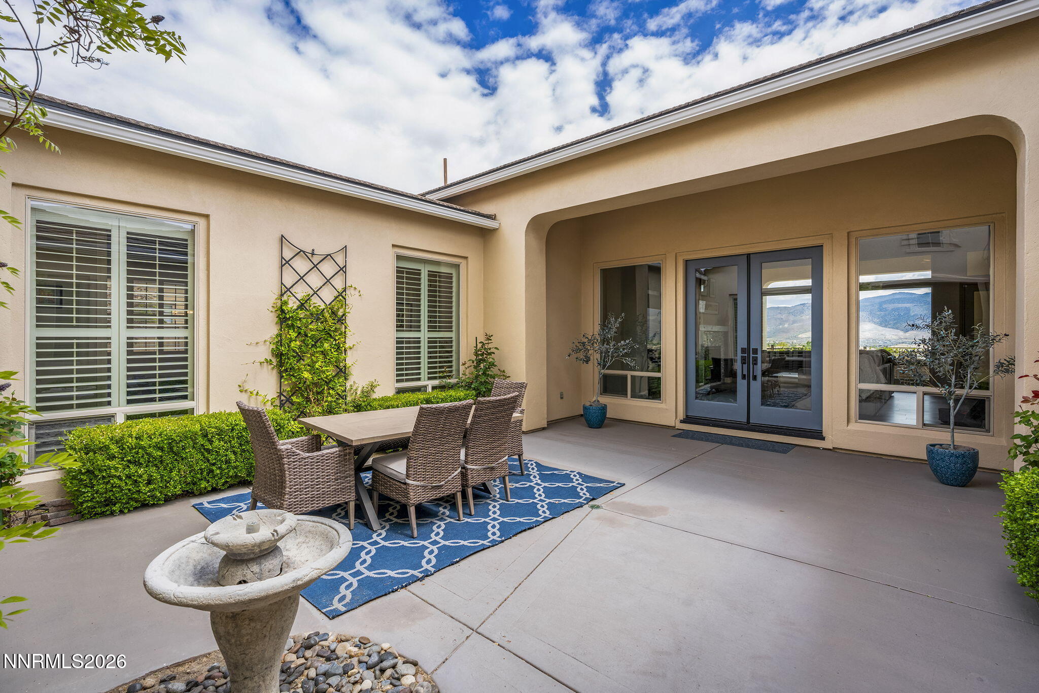 13340 Damonte View Lane Reno, NV 89511 - Photo 5 of 44 a view of a patio with chairs and potted plants