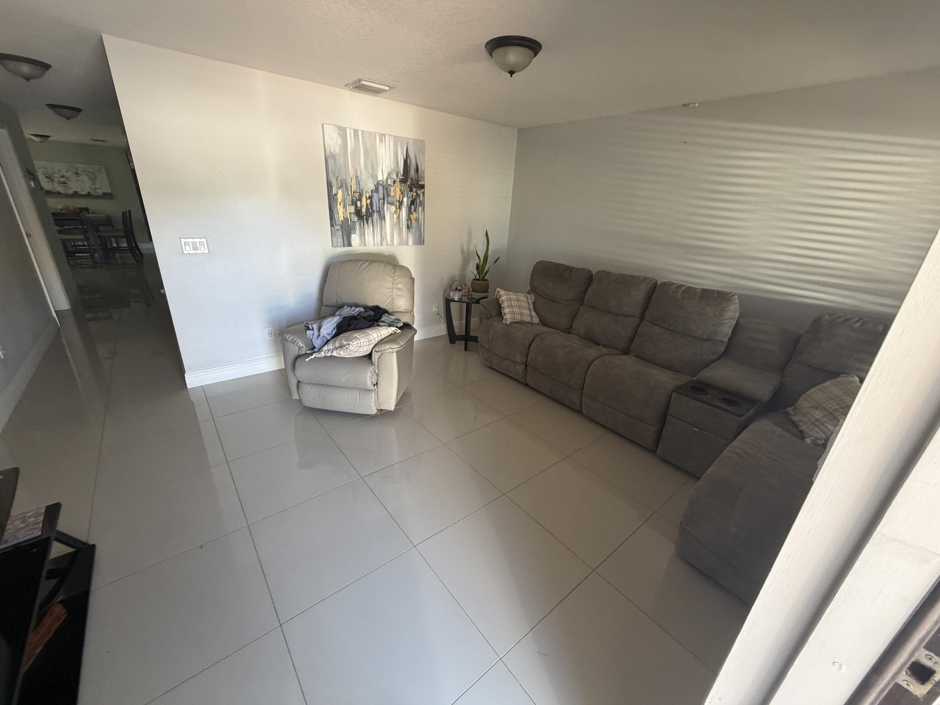 5928 Papaya Road Royal Palm Estates, FL 33413 - Photo 2 of 12 a living room with furniture