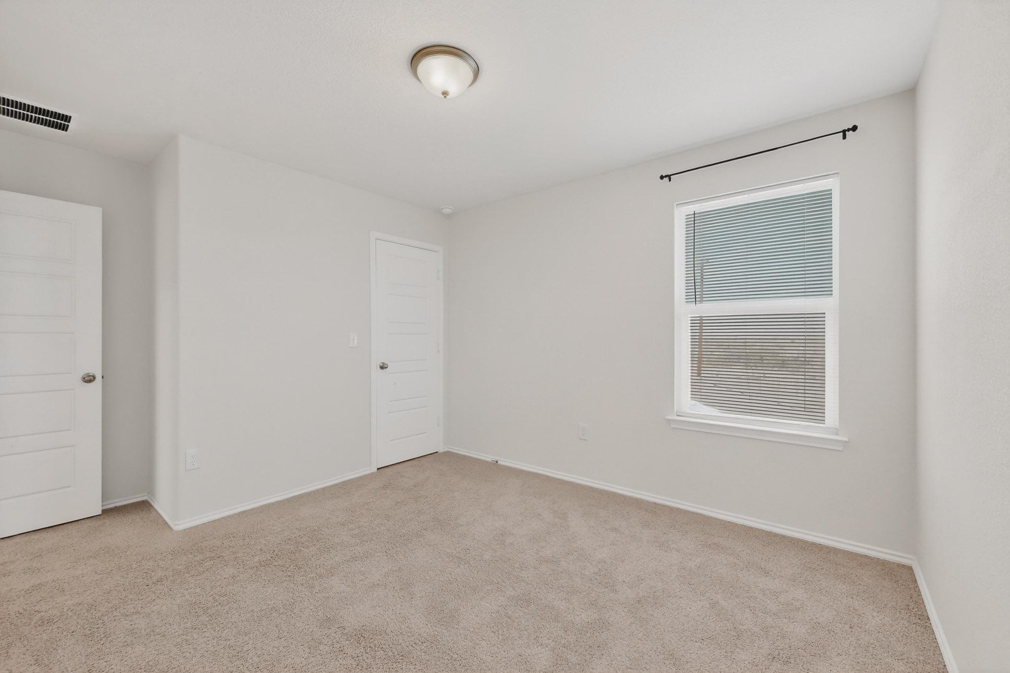 14513 Booted Eagle Pass Elgin, TX 78621 - Photo 22 of 34 an empty room with a window