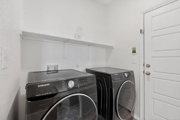 a utility room with dryer and washer