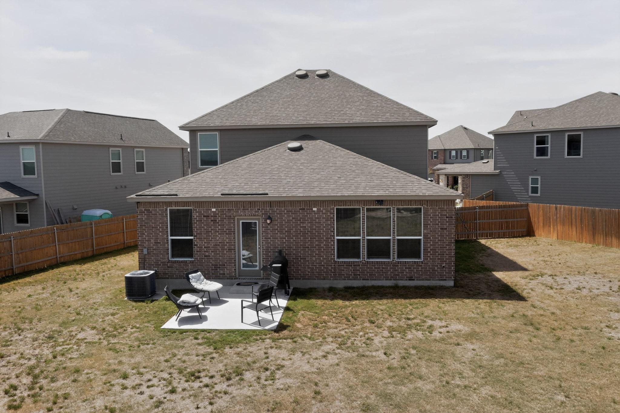 14513 Booted Eagle Pass Elgin, TX 78621 - Photo 32 of 34 a front view of a house with garden