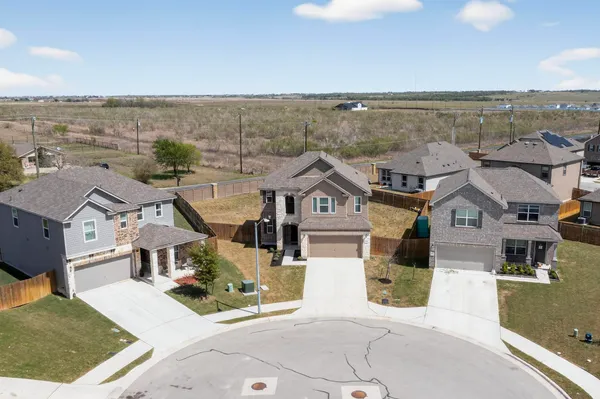 an aerial view of a house with a garden