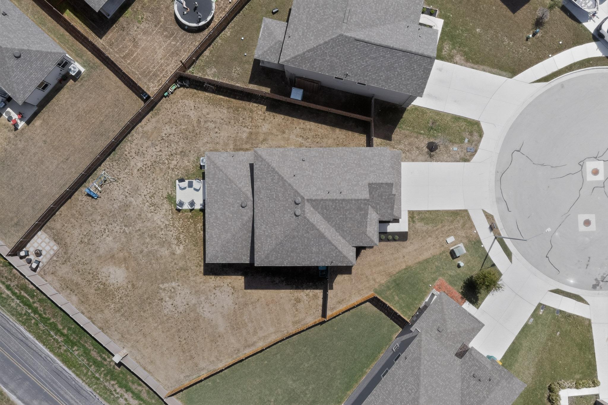 14513 Booted Eagle Pass Elgin, TX 78621 - Photo 4 of 34 an aerial view of a house with a yard