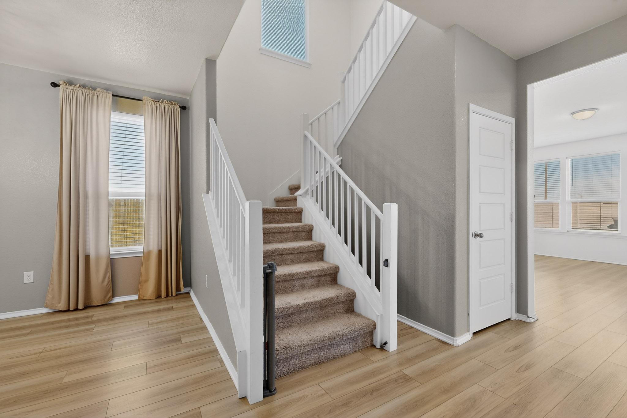 14513 Booted Eagle Pass Elgin, TX 78621 - Photo 6 of 34 a view of a hallway with wooden floor and entryway
