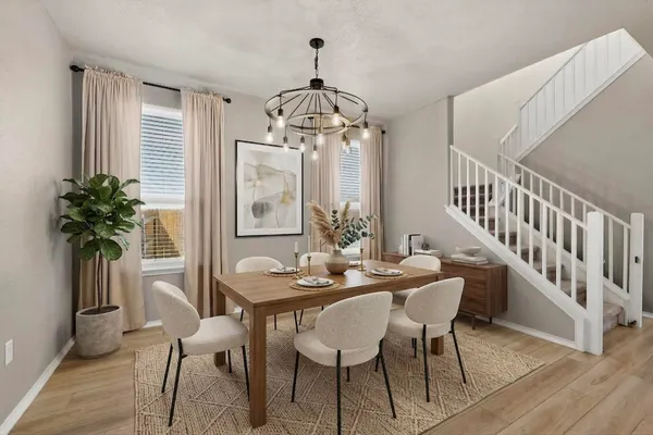 a view of a dining room with furniture window and wooden floor
