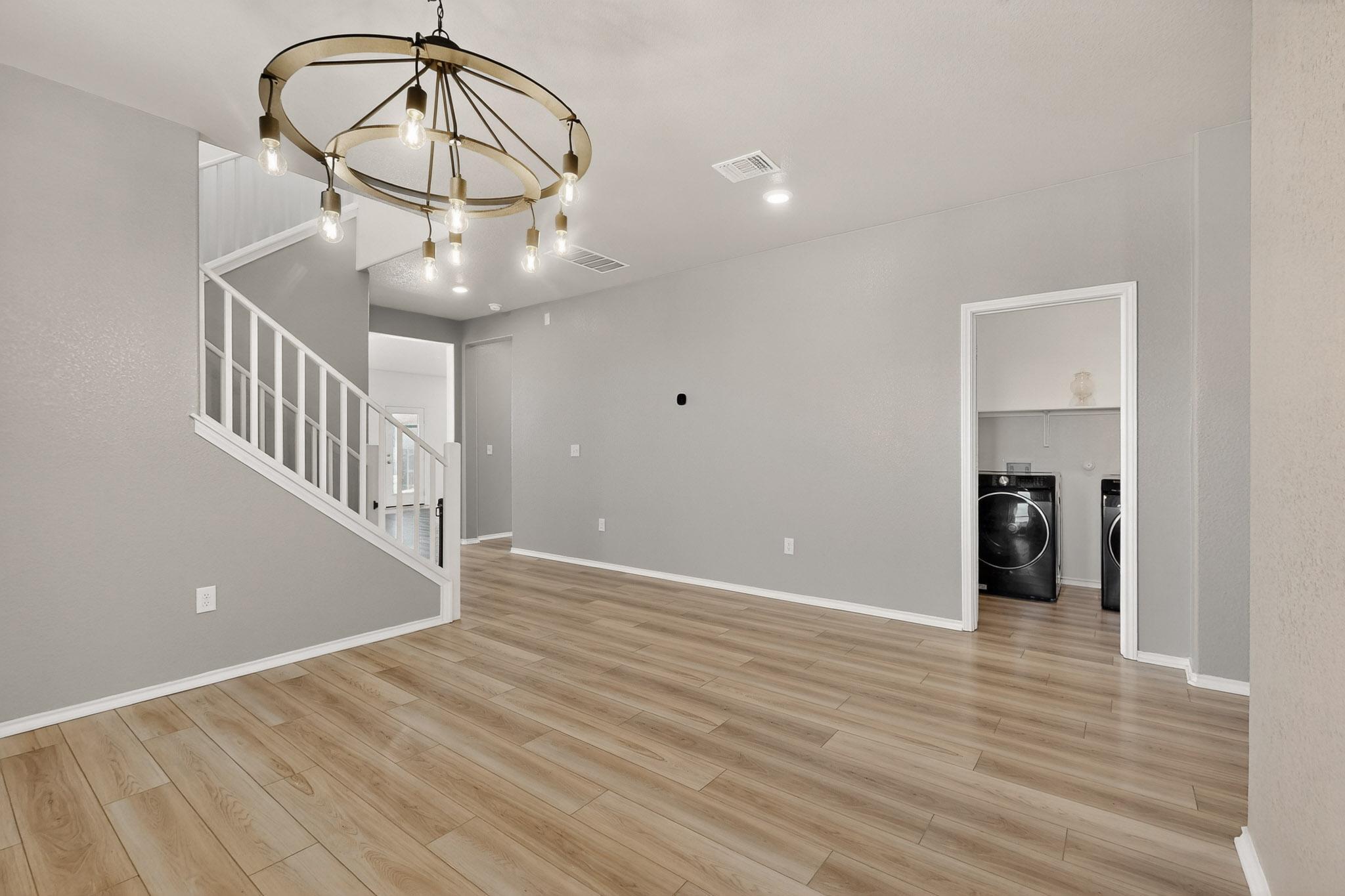 14513 Booted Eagle Pass Elgin, TX 78621 - Photo 9 of 34 a view of entryway and hall with wooden floor