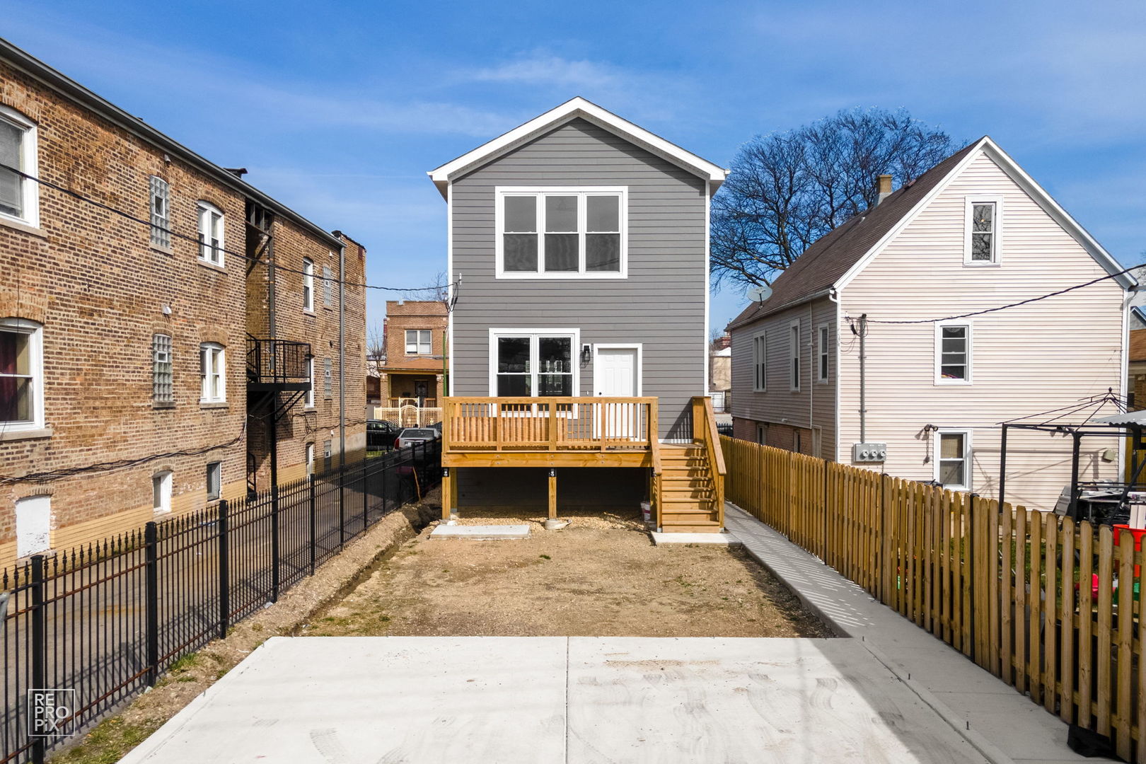 4241 West Walton Street Chicago, IL 60651 - Photo 15 of 15 a front view of a house with glass doors