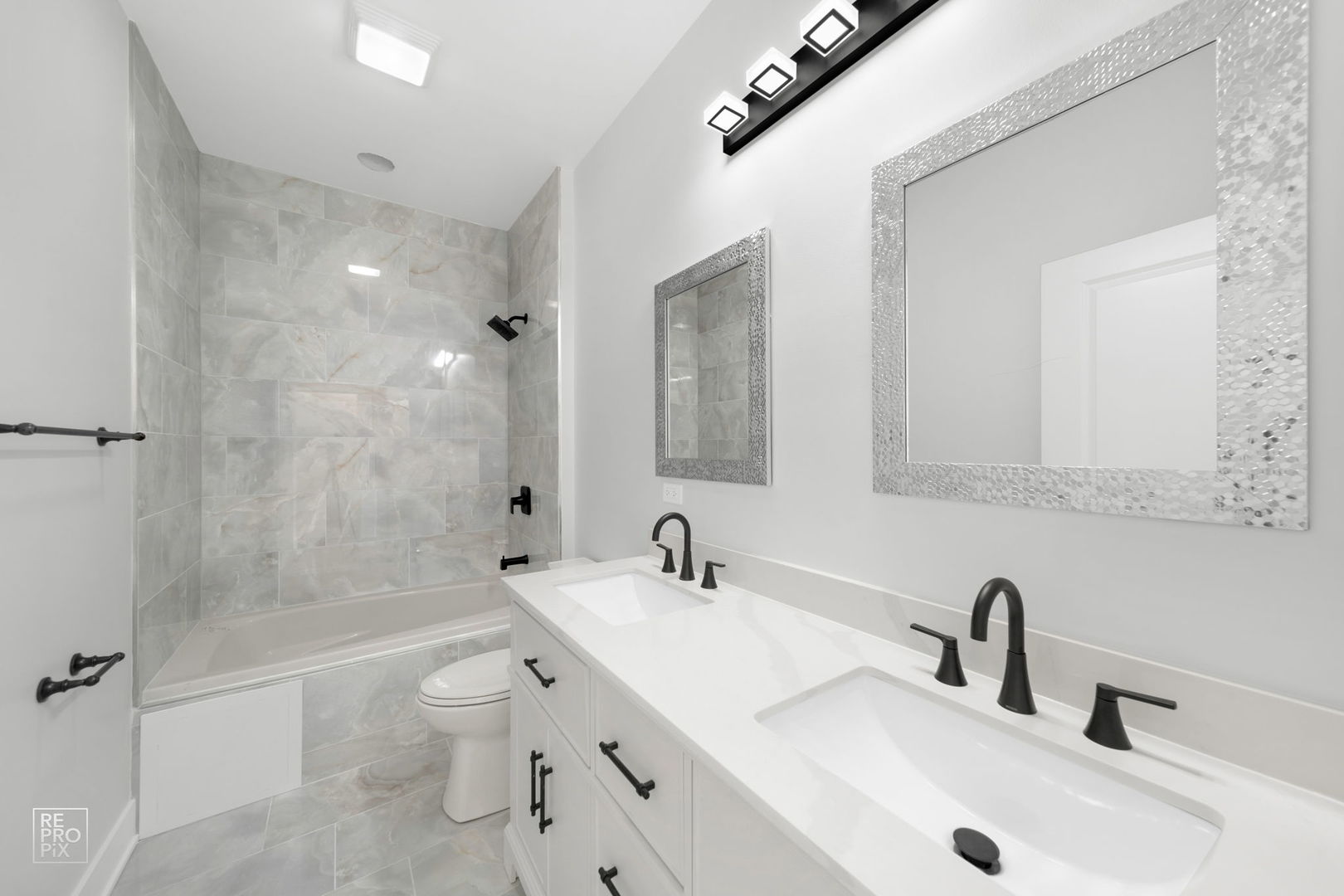 4241 West Walton Street Chicago, IL 60651 - Photo 10 of 15 a bathroom with a toilet a sink and a bathtub