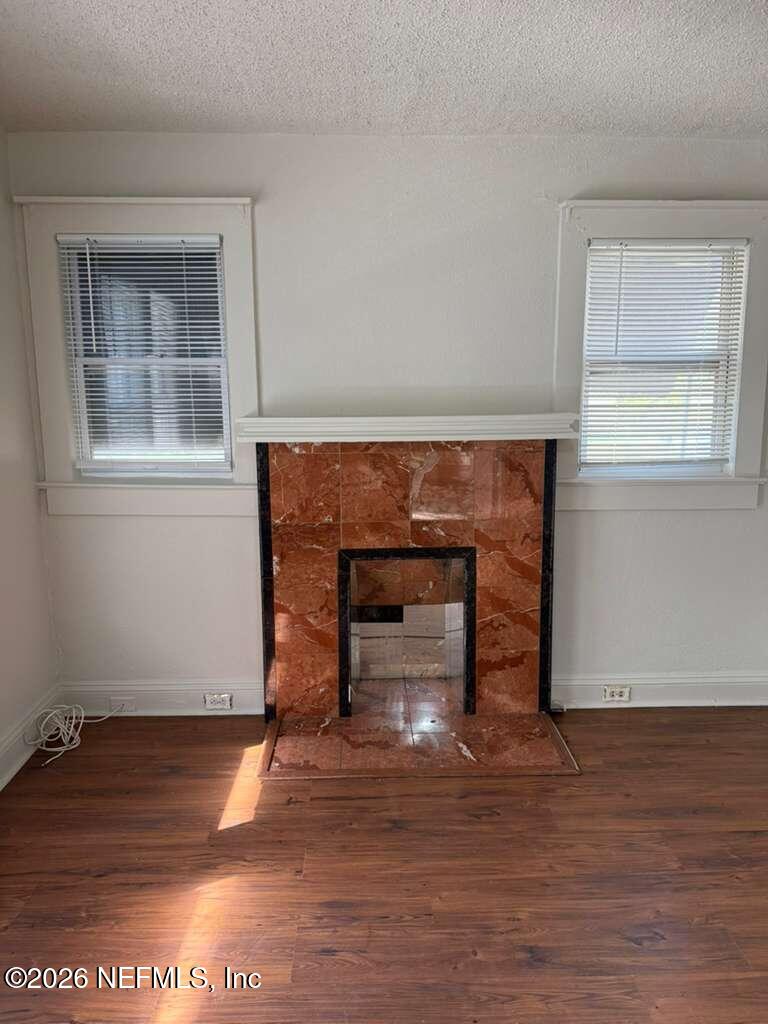 4067 Gilmore Street Jacksonville, FL 32205 - Photo 10 of 10 a view of an empty room with wooden floor and a window