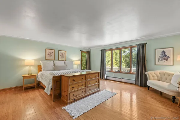 a spacious bedroom with a bed and a couch