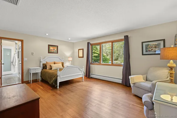 a bedroom with a bed and a couch