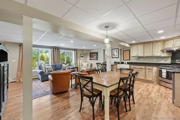 a view of a dining room with furniture window and wooden floor