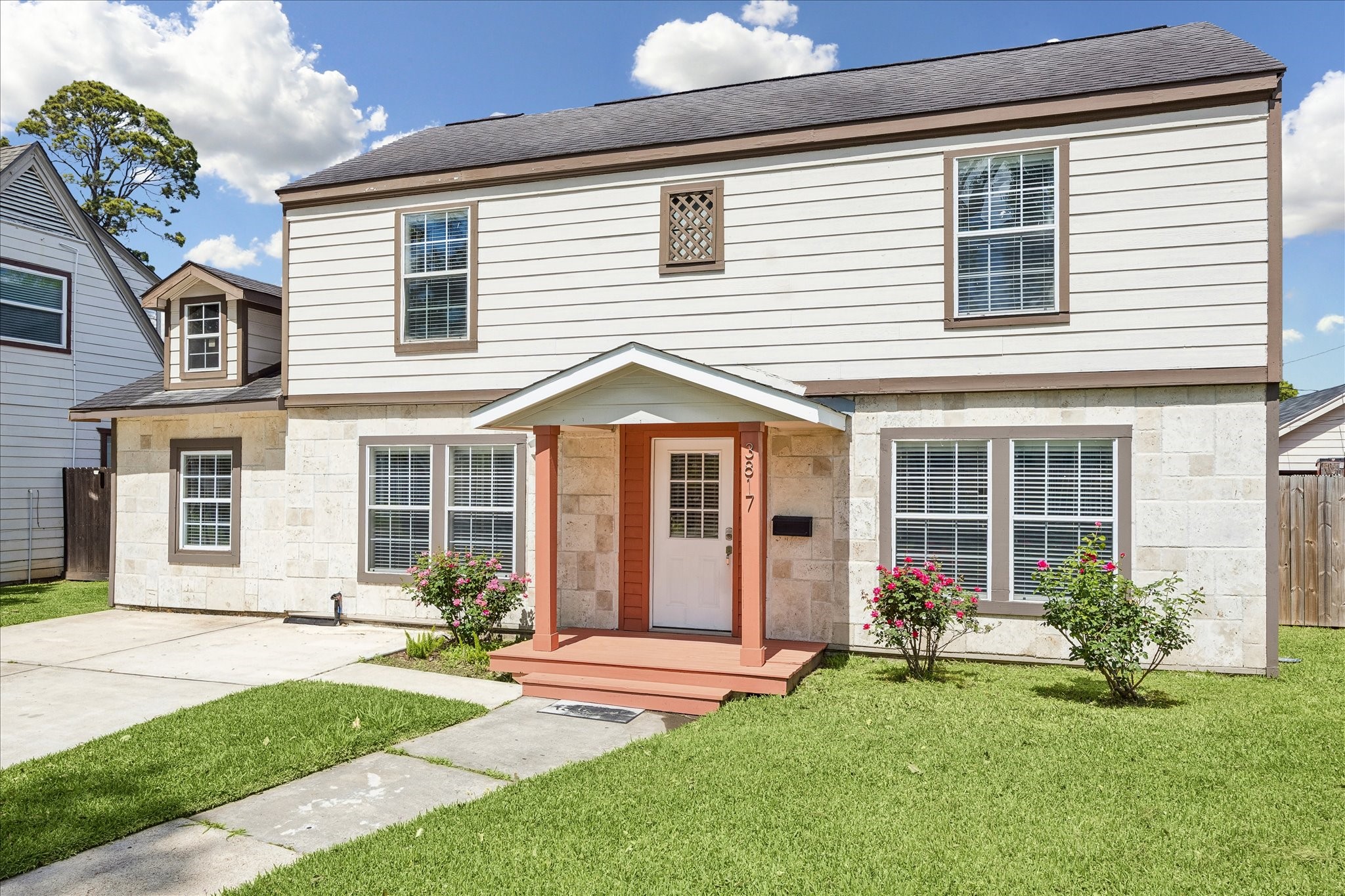 3817 Palm Street Houston, TX 77004 - Photo 1 of 15 a front view of a house with a yard and porch