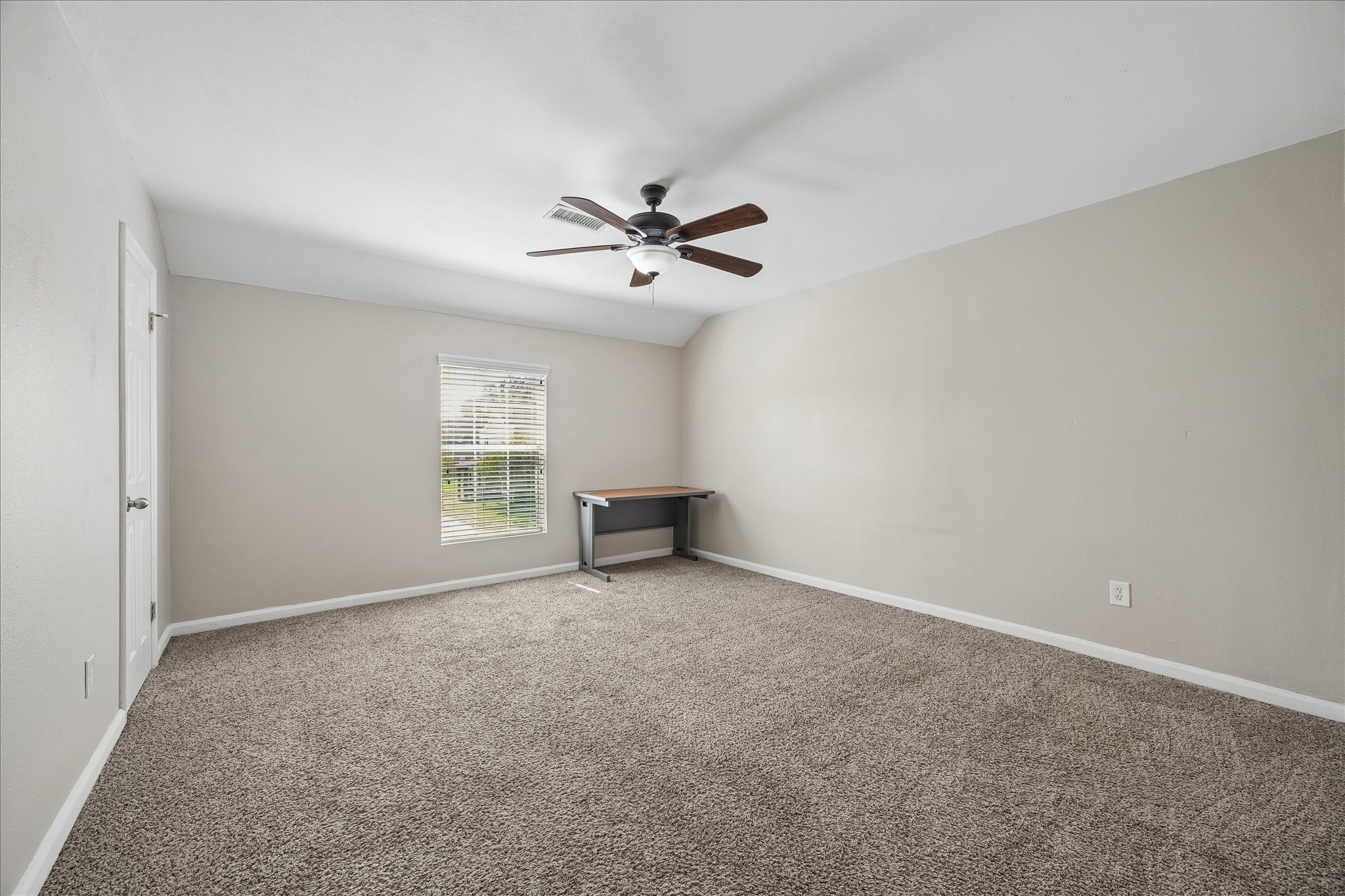 3817 Palm Street Houston, TX 77004 - Photo 15 of 15 an empty room with windows and fan