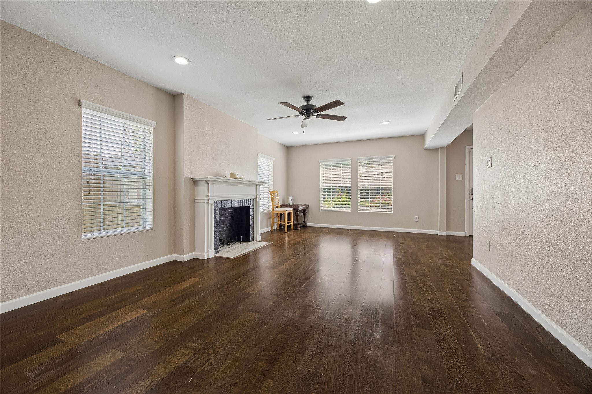 3817 Palm Street Houston, TX 77004 - Photo 2 of 15 a view of an empty room with a window and wooden floor