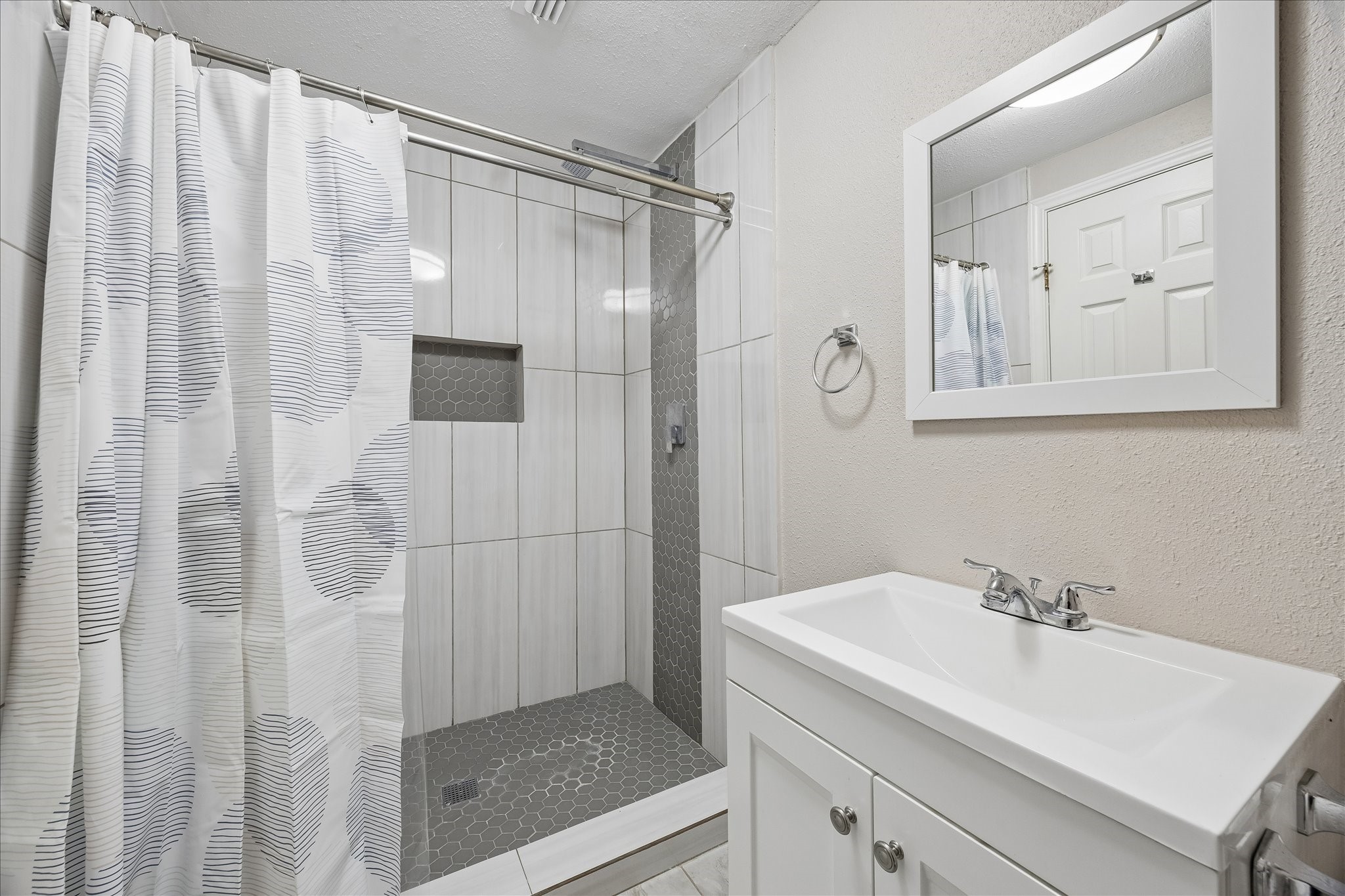 3817 Palm Street Houston, TX 77004 - Photo 8 of 15 a bathroom with a shower and a sink