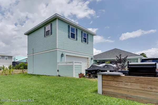 a view of house with garden space and street view