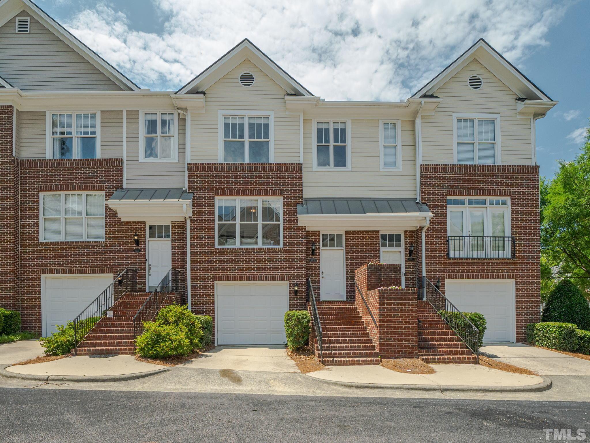 6109 Shandwick Court Raleigh, NC 27609 - Photo 1 of 36 a front view of a house with a yard and garage