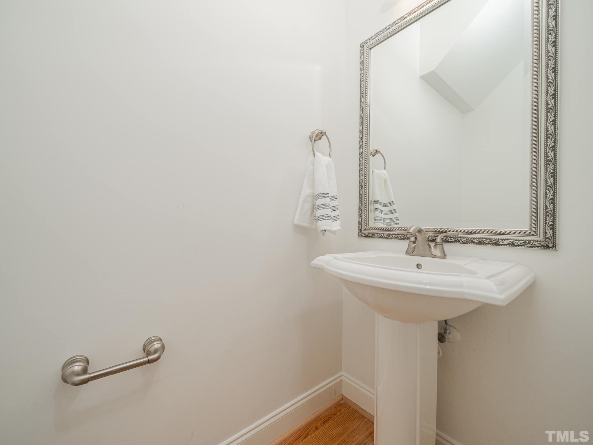 6109 Shandwick Court Raleigh, NC 27609 - Photo 19 of 36 a bathroom with a sink and mirror
