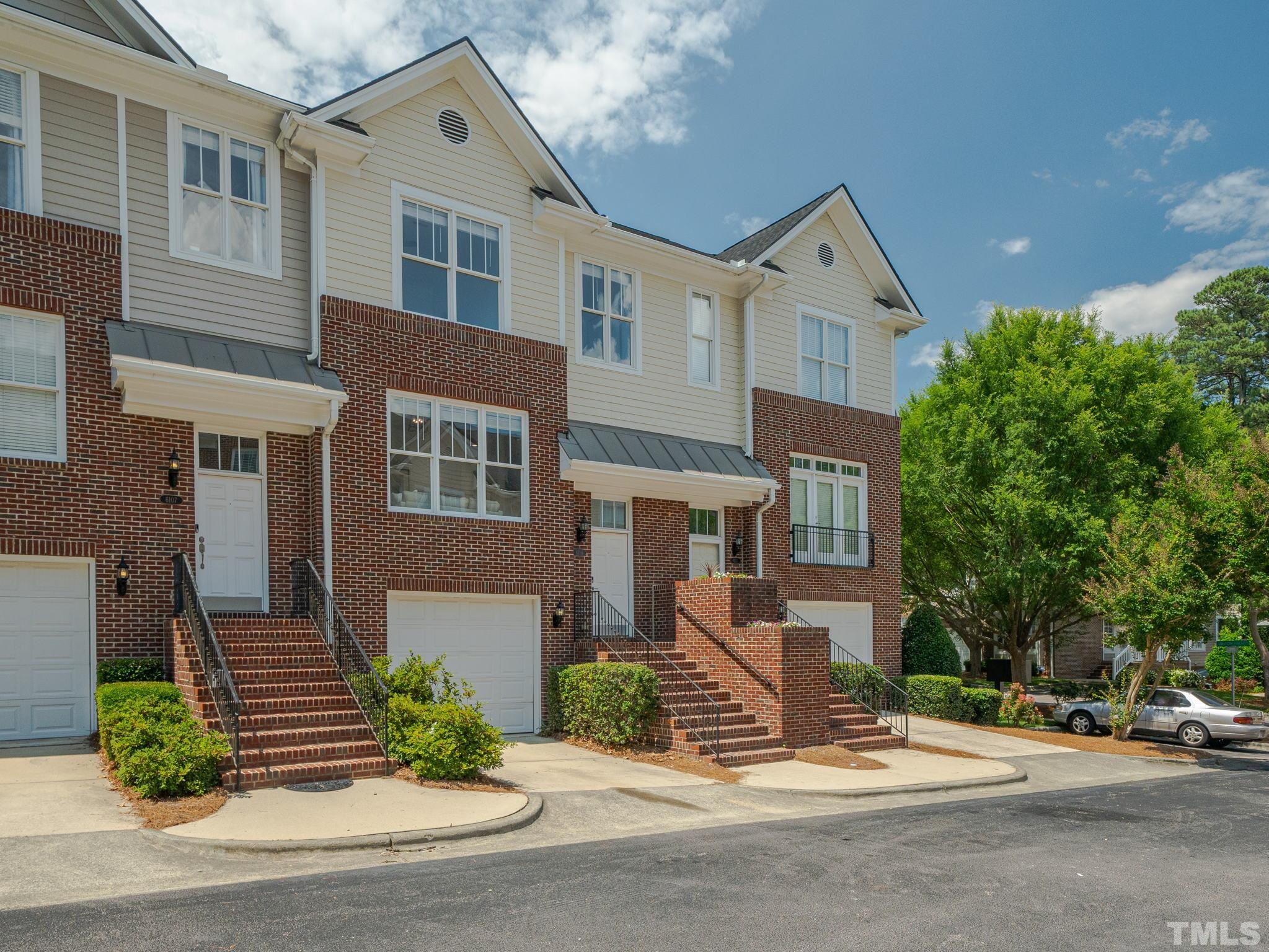 6109 Shandwick Court Raleigh, NC 27609 - Photo 2 of 36 a front view of a house with a yard and garage