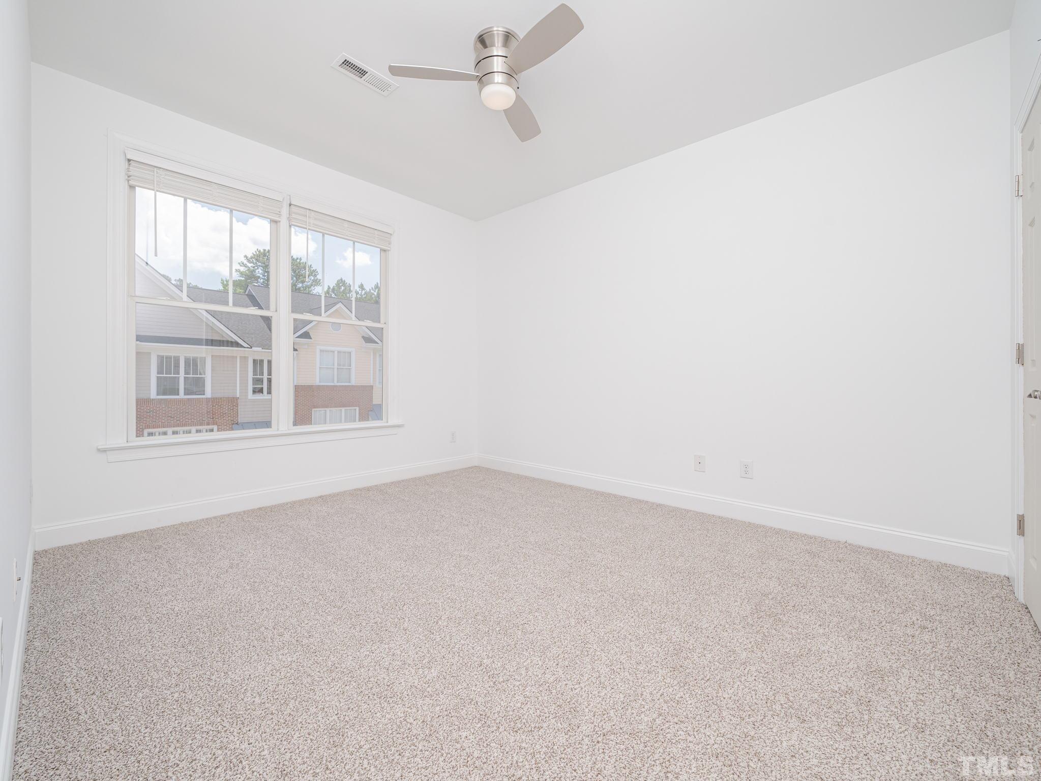 6109 Shandwick Court Raleigh, NC 27609 - Photo 22 of 36 an empty room with a window
