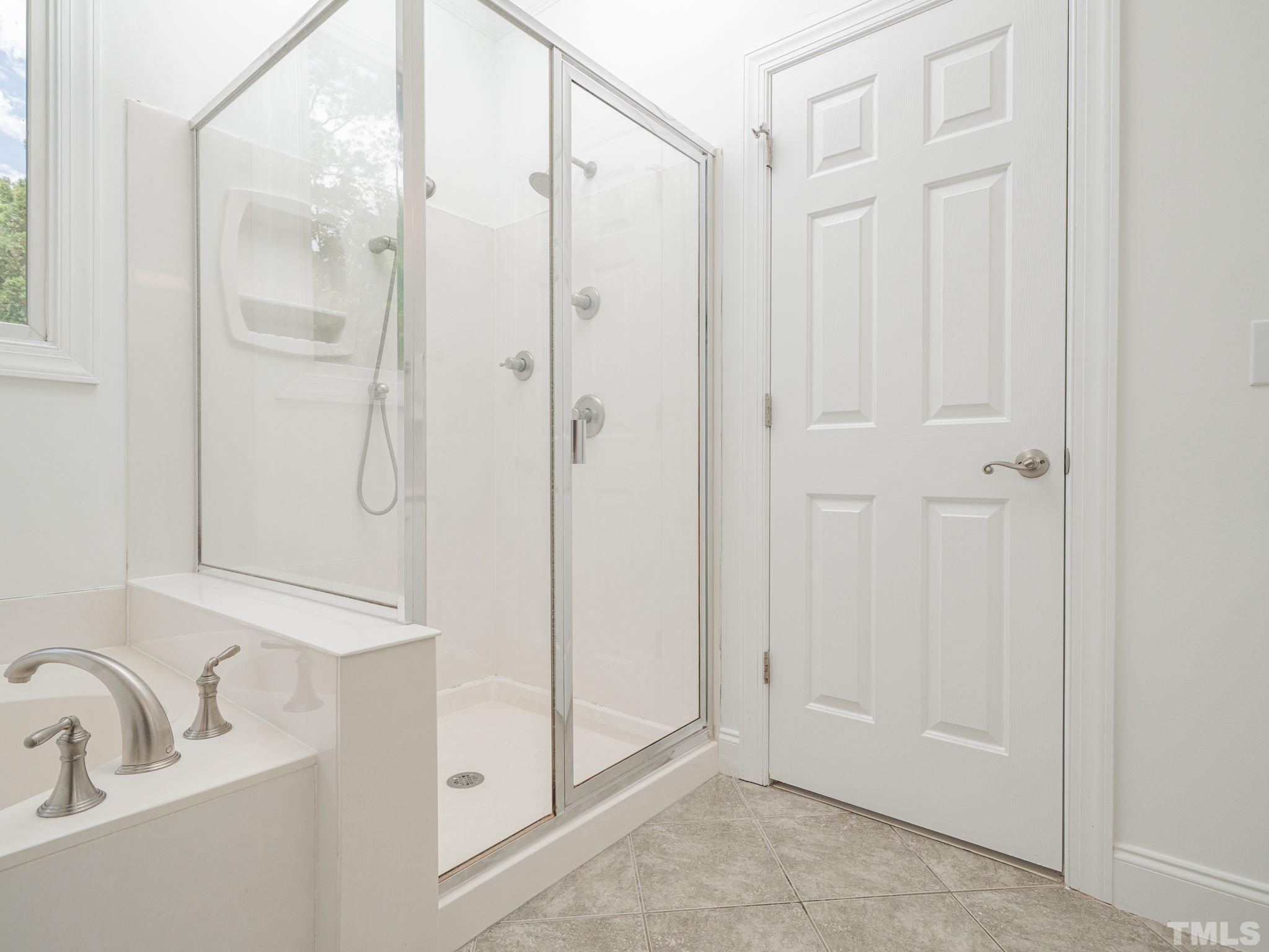 6109 Shandwick Court Raleigh, NC 27609 - Photo 30 of 36 a bathroom with a shower and a sink