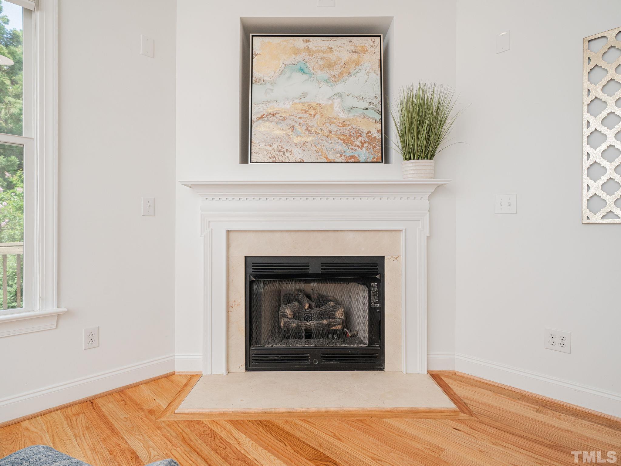 6109 Shandwick Court Raleigh, NC 27609 - Photo 9 of 36 a white building with a fireplace
