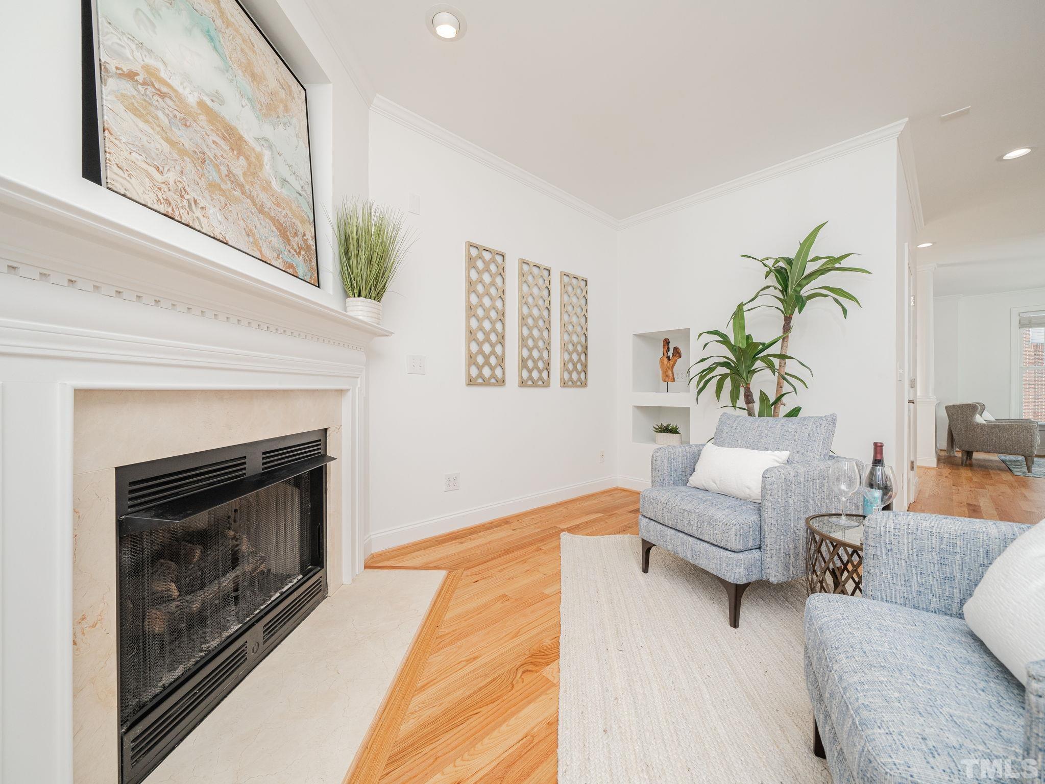 6109 Shandwick Court Raleigh, NC 27609 - Photo 10 of 36 a living room with furniture and a fireplace