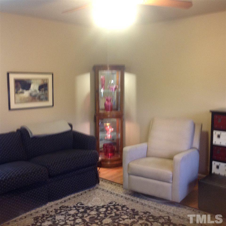 512 Forest Ridge Road Garner, NC 27529 - Photo 9 of 12 ceiling fan in spotless living room,view from front door