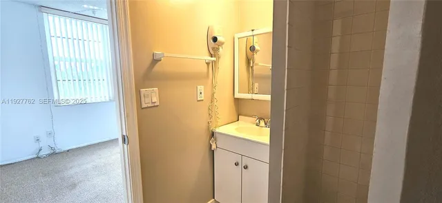 a view of an empty room with a window