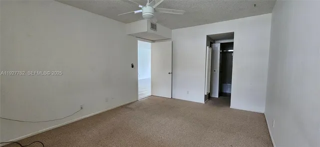 a view of a lake with houses in the back