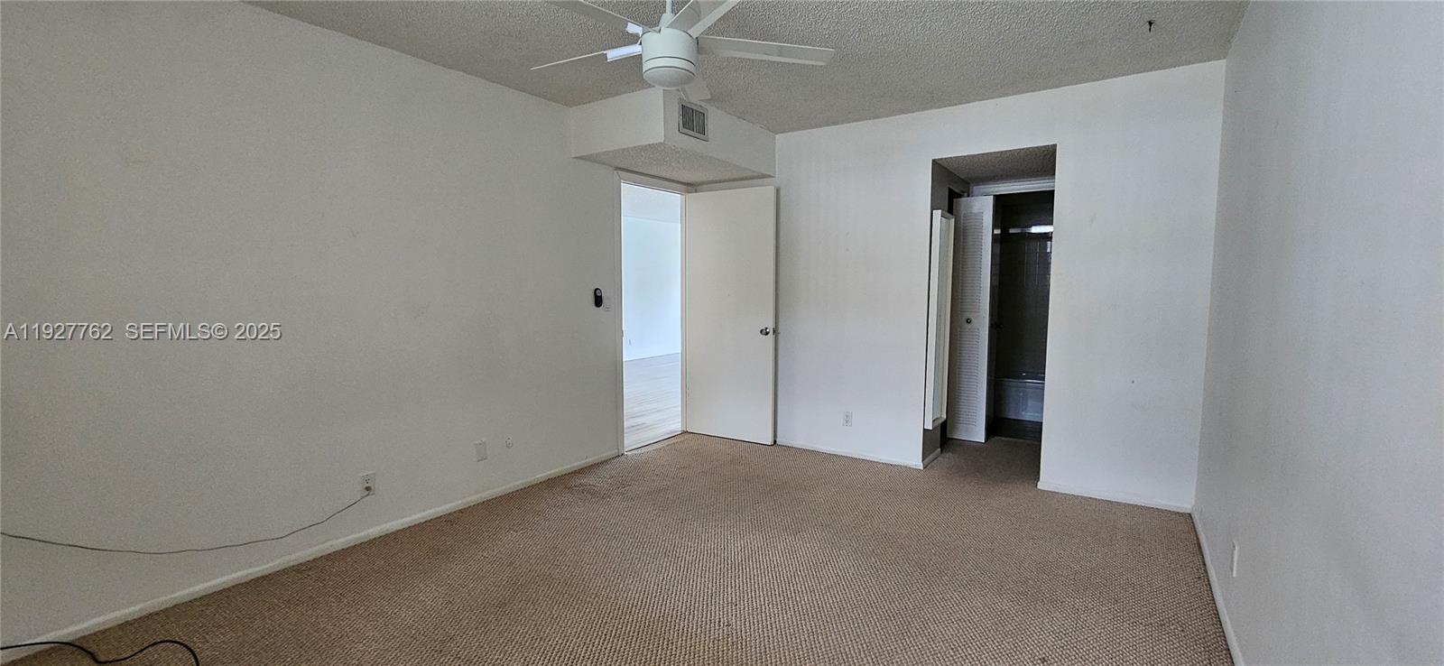 9450 Poinciana Place, Unit 103 Davie, FL 33324 - Photo 27 of 30 an empty room with a bathroom