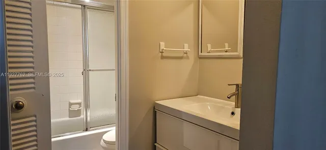 a bathroom with a sink and mirror