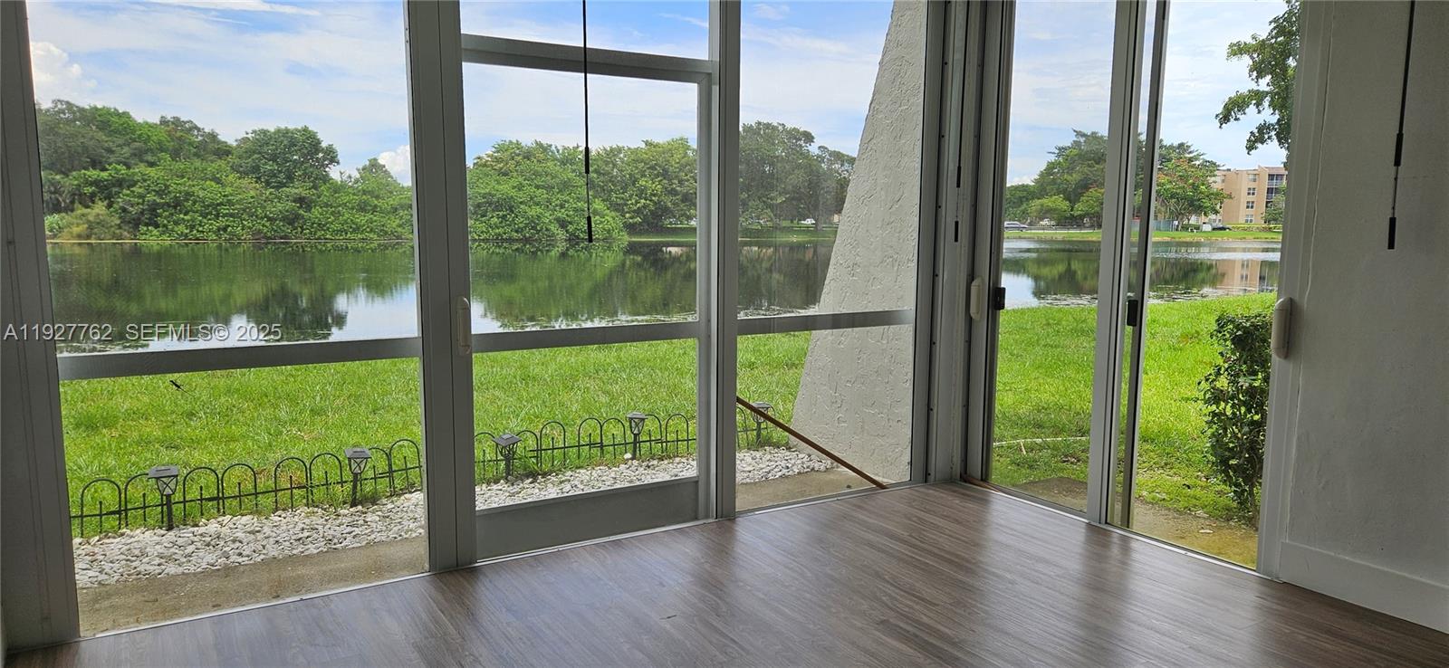 9450 Poinciana Place, Unit 103 Davie, FL 33324 - Photo 9 of 30 a view of a garden from a window