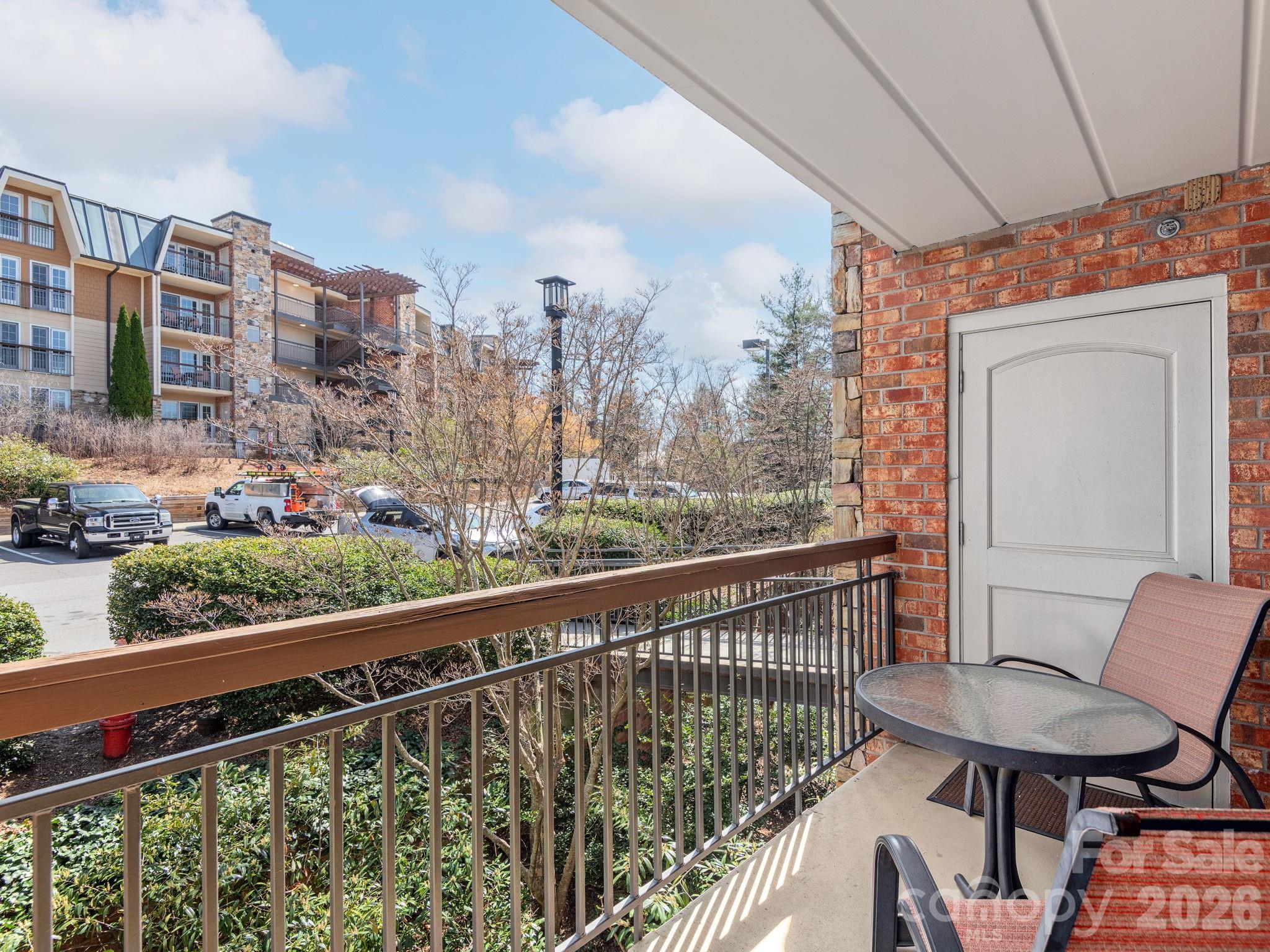 307 Bowling Park Road Asheville, NC 28803 - Photo 11 of 19 a view of a chairs and table in the balcony