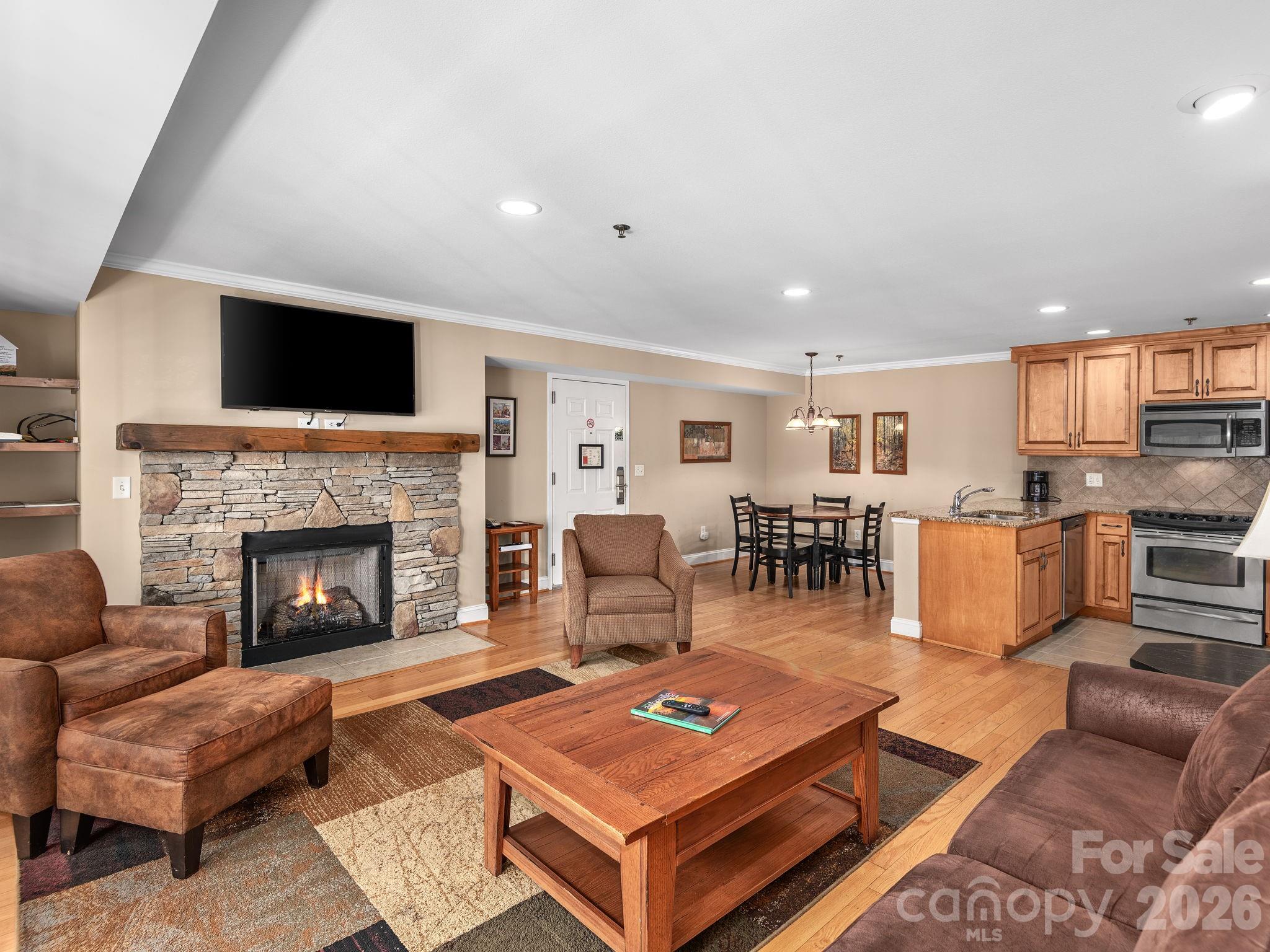 307 Bowling Park Road Asheville, NC 28803 - Photo 12 of 19 a living room with furniture and a fireplace