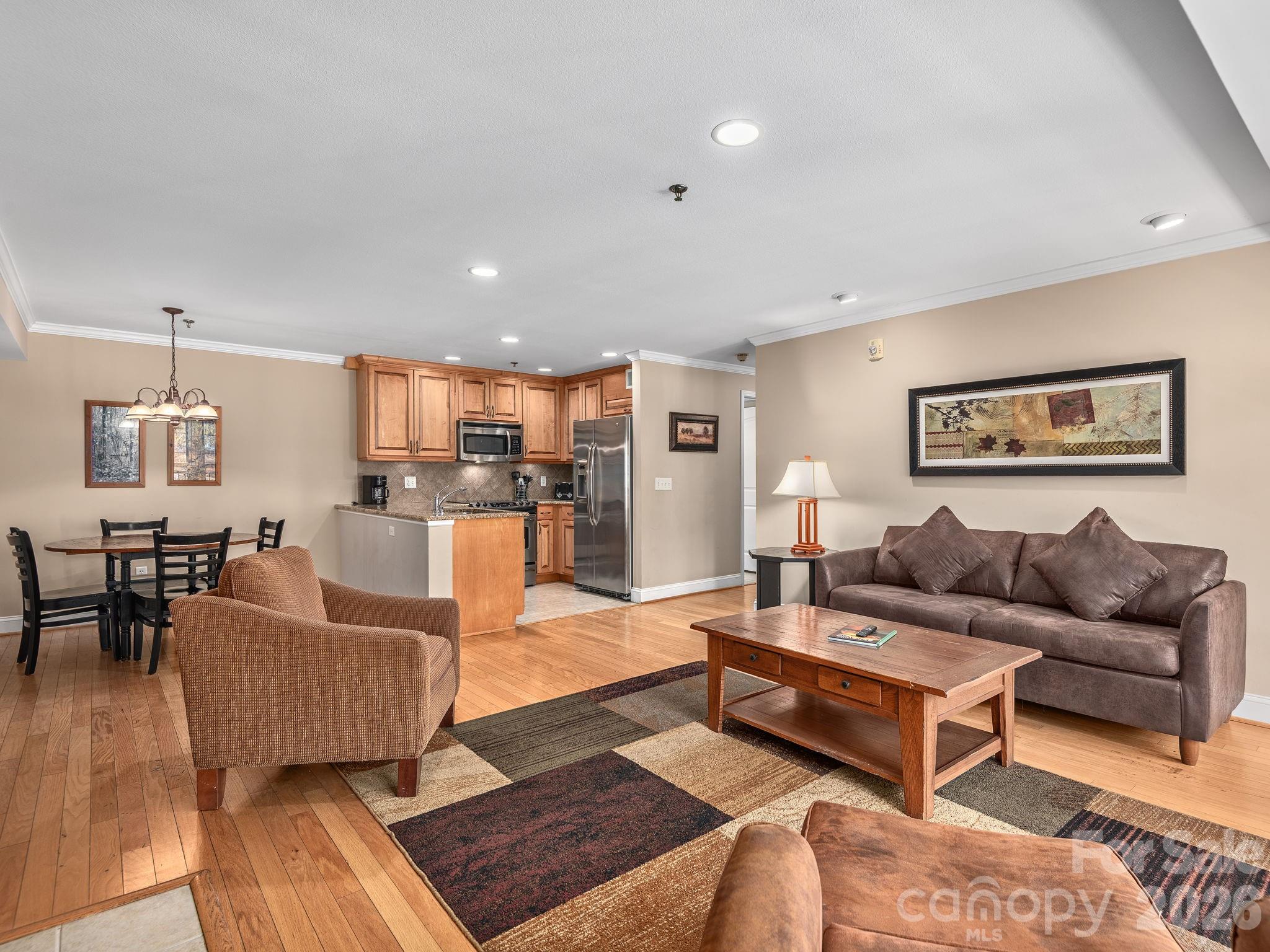307 Bowling Park Road Asheville, NC 28803 - Photo 5 of 19 a living room with furniture and kitchen view