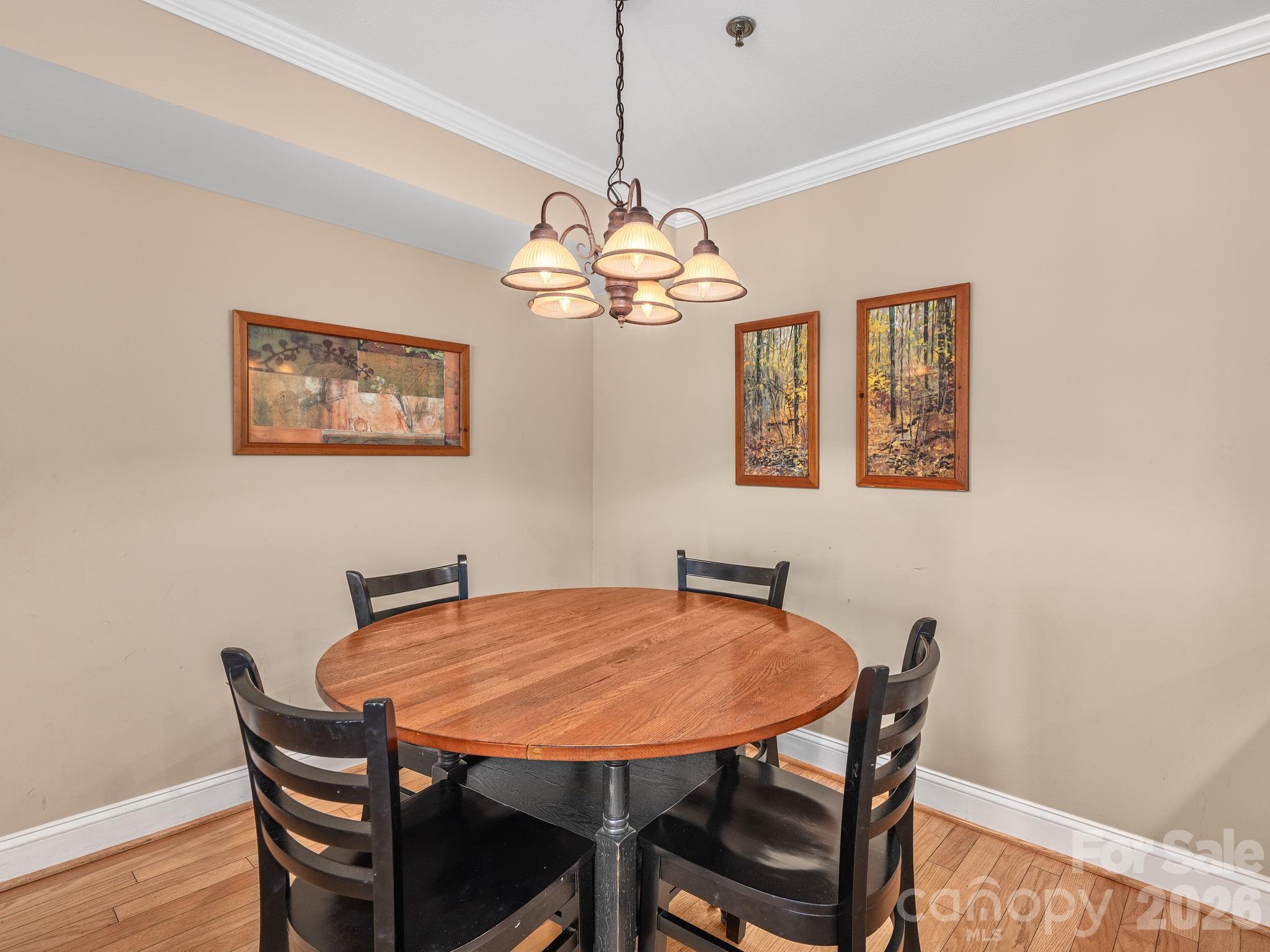 307 Bowling Park Road Asheville, NC 28803 - Photo 6 of 19 a dining room with furniture and chandelier