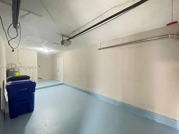 a view of a closet area with wooden floor