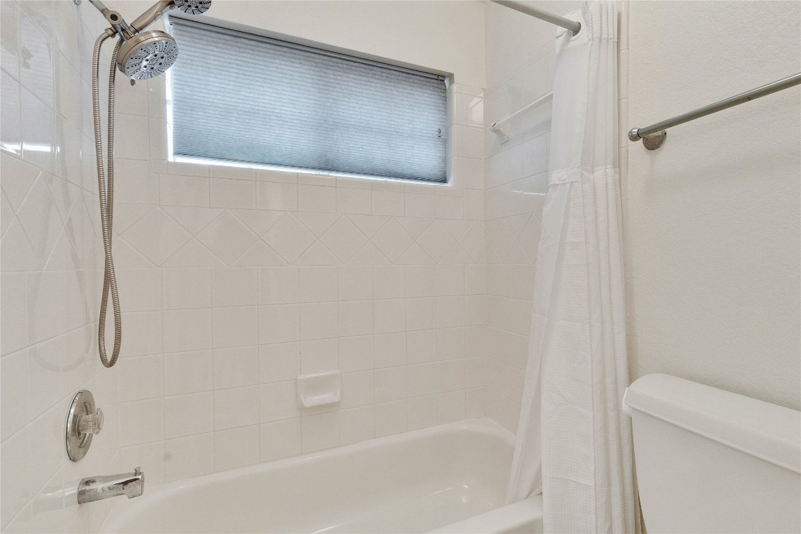 5407 Merrywing Circle Austin, TX 78730 - Photo 26 of 36 Full bathroom featuring shower / bath combination with curtain and toilet