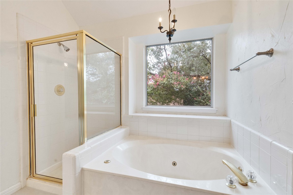 5407 Merrywing Circle Austin, TX 78730 - Photo 32 of 36 Full bath with a whirlpool tub and a shower stall