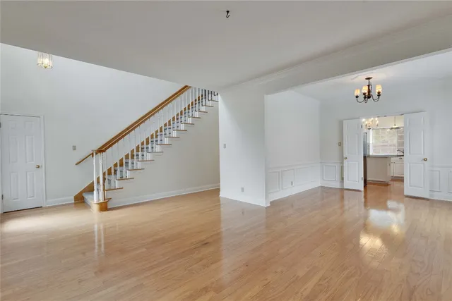 a view of an entryway with wooden floor