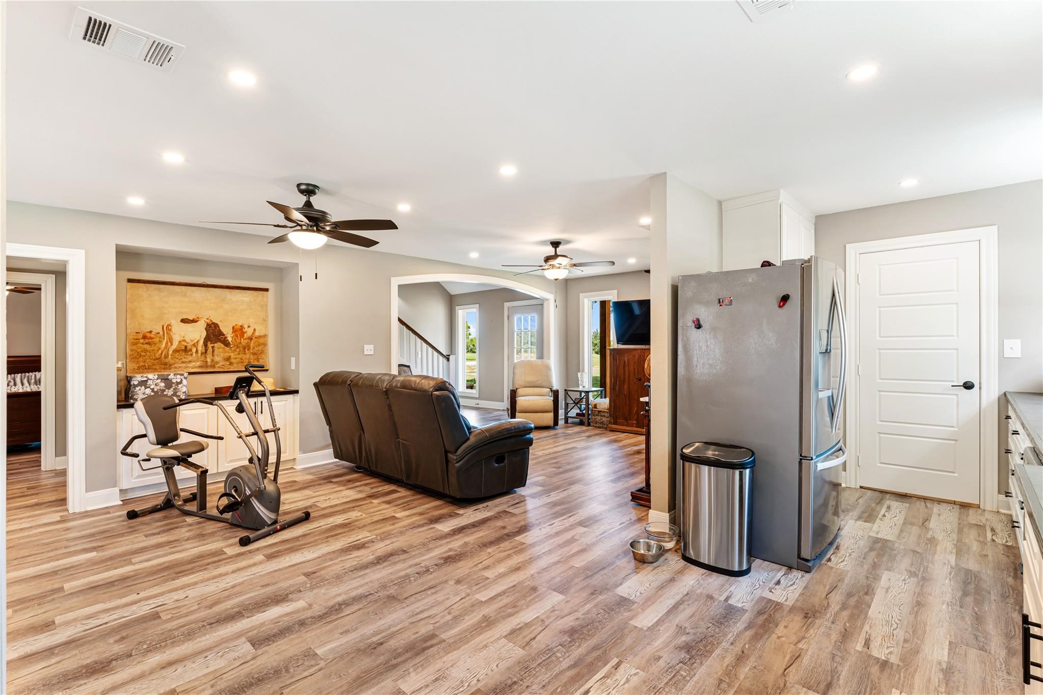 6063 Fm 1094 Sealy, TX 77474 - Photo 19 of 47 a living room with furniture a refrigerator and wooden floor