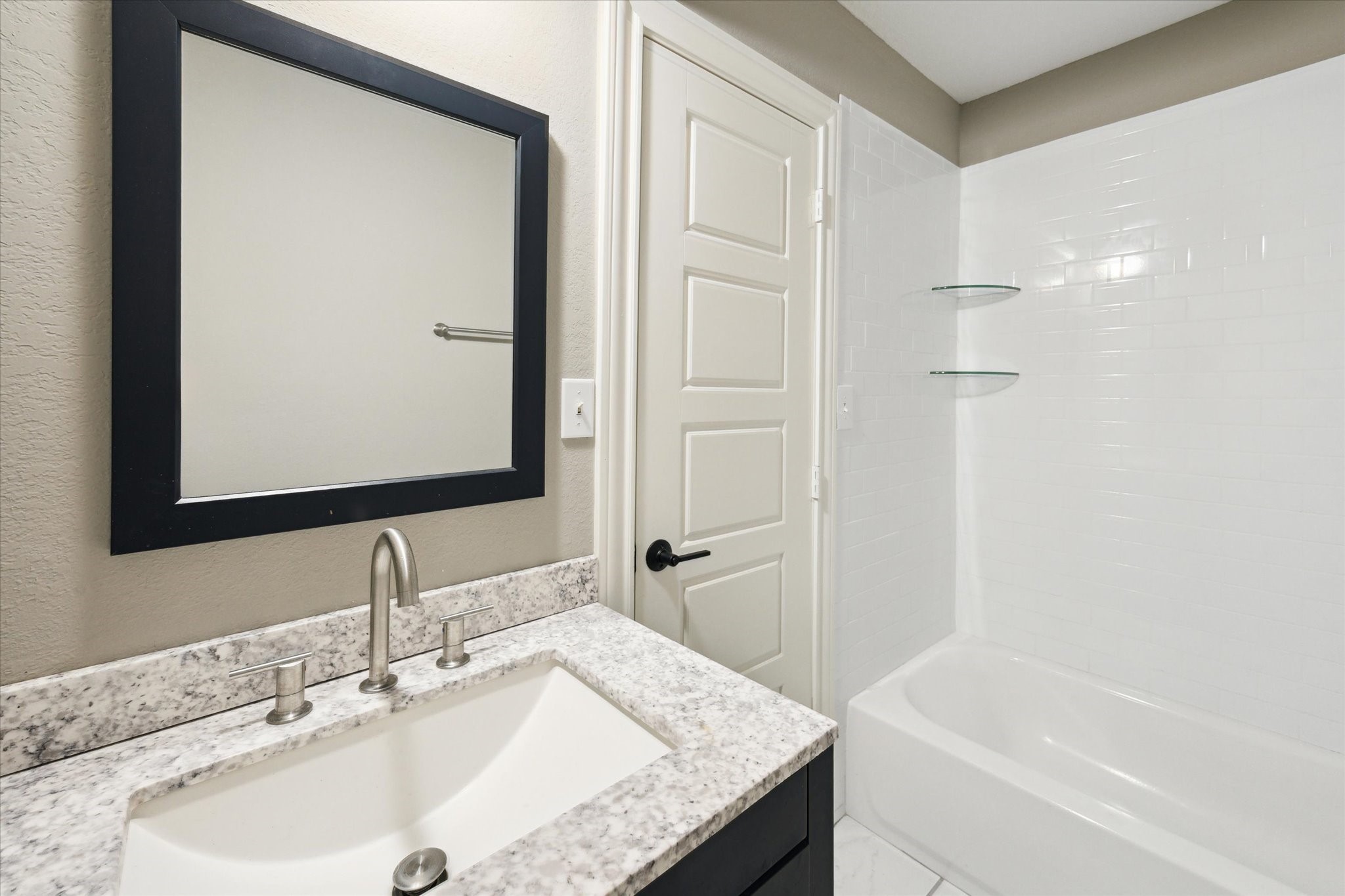 6063 Fm 1094 Sealy, TX 77474 - Photo 22 of 47 a bathroom with a granite countertop sink and a mirror