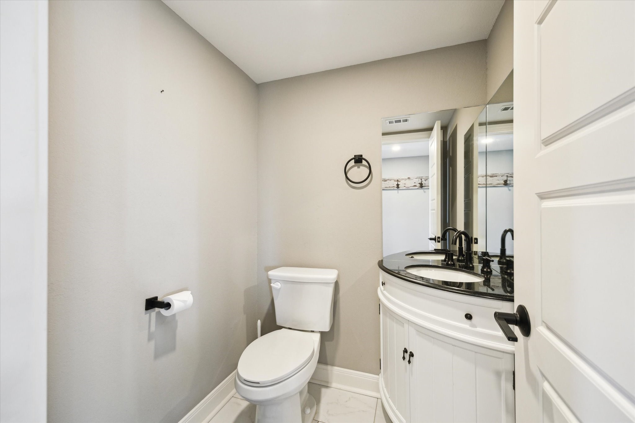 6063 Fm 1094 Sealy, TX 77474 - Photo 23 of 47 a bathroom with a toilet a sink and mirror