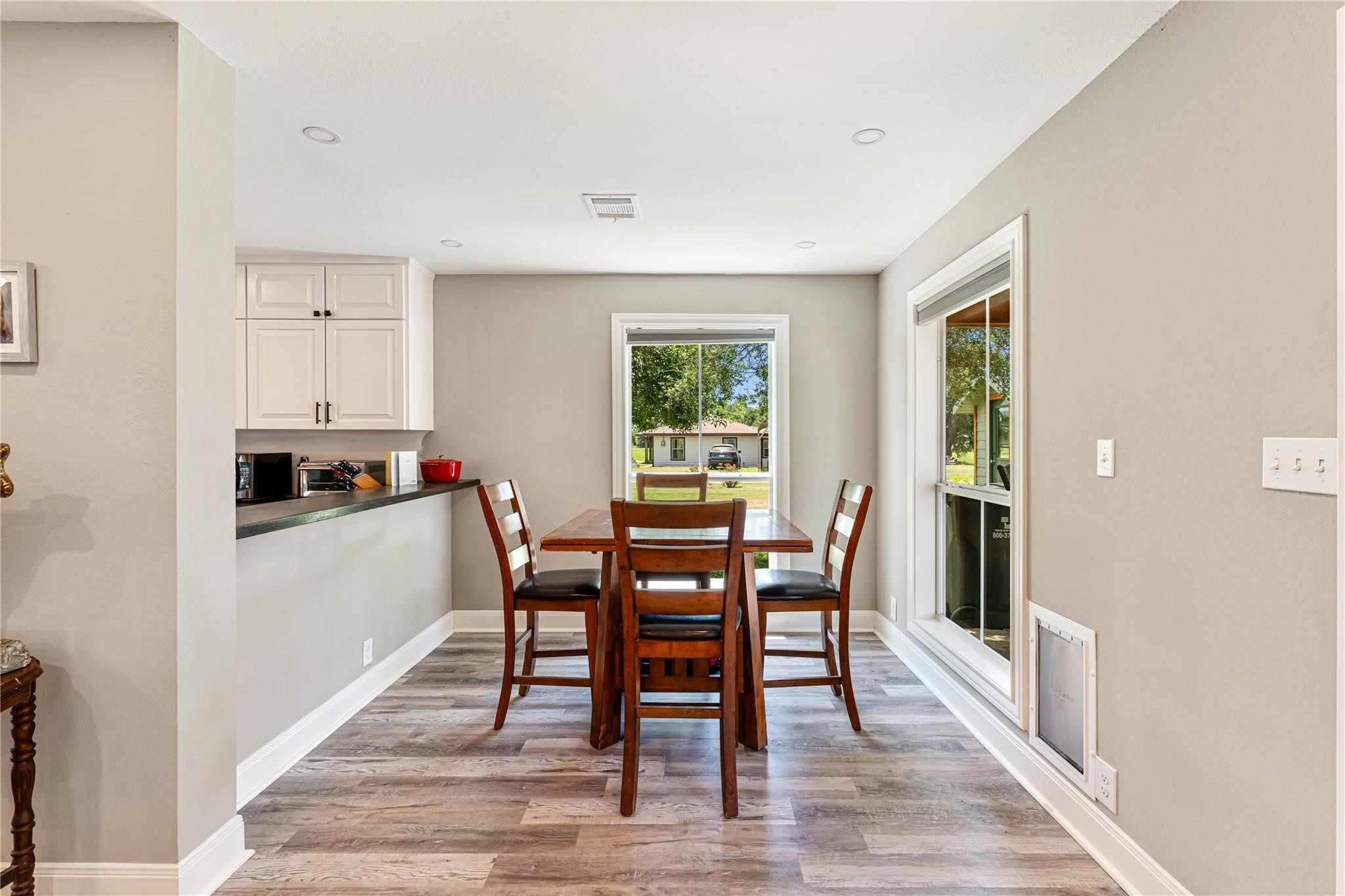 6063 Fm 1094 Sealy, TX 77474 - Photo 25 of 47 a view of a dining room with furniture and wooden floor