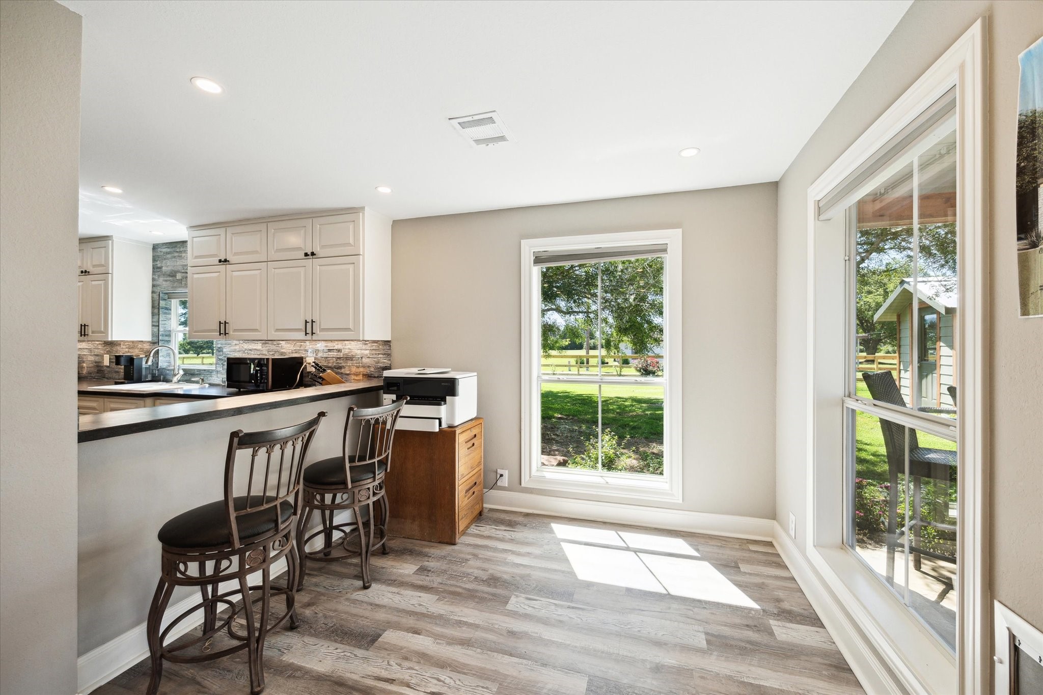 6063 Fm 1094 Sealy, TX 77474 - Photo 28 of 47 a kitchen with a table chairs sink and cabinets