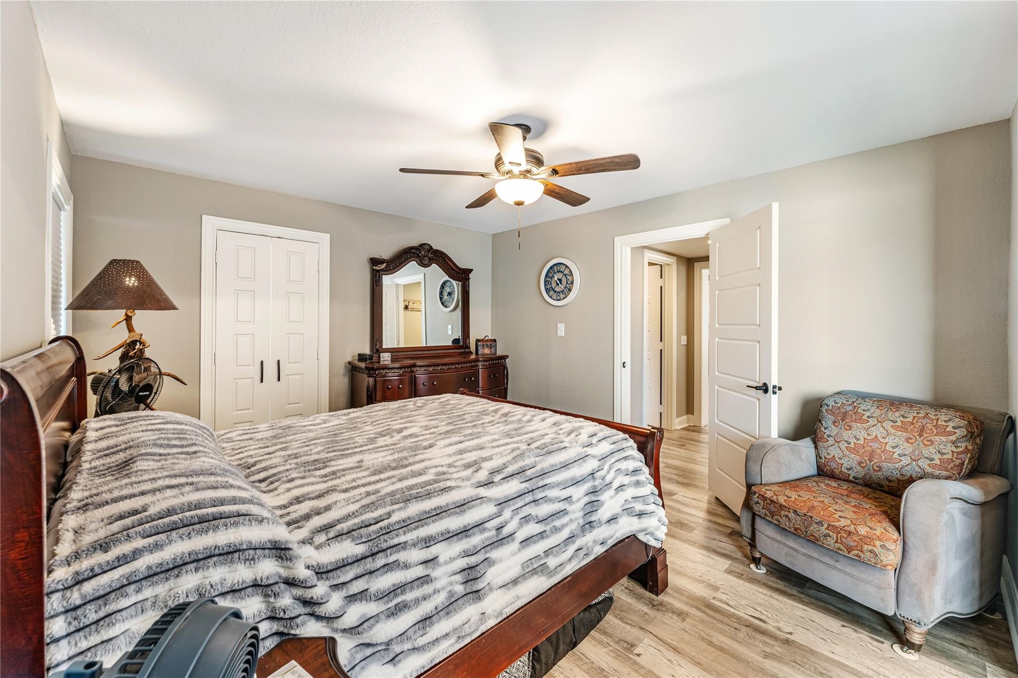 6063 Fm 1094 Sealy, TX 77474 - Photo 29 of 47 a bedroom with a bed couches and chandelier