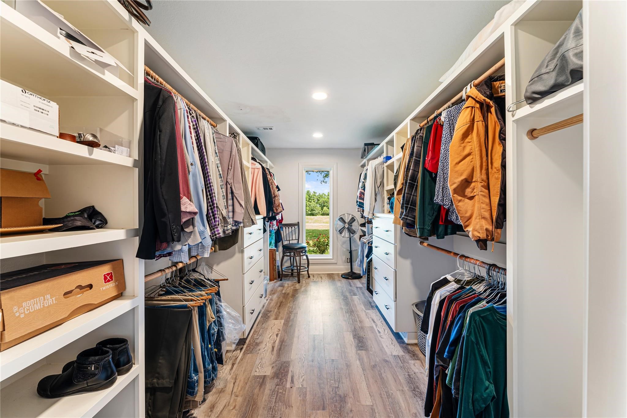 6063 Fm 1094 Sealy, TX 77474 - Photo 31 of 47 a view of walk in closet with clothes and shoes